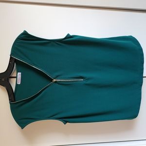 Green sleeveless blouse